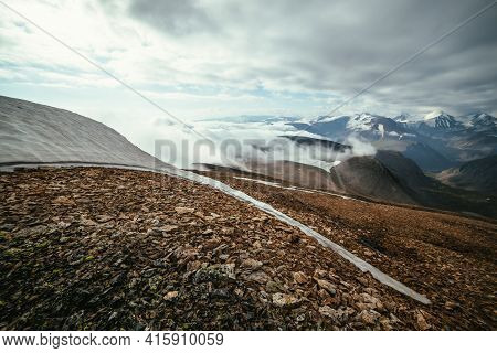 Scenic Alpine Landscape With Layers Of Mountains To Horizon In Dense Low Clouds. Wonderful Layered M