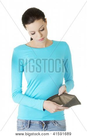 Young woman shows her empty wallet. Bankruptcy concept
