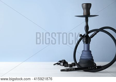 Traditional Hookah On White Table. Space For Text