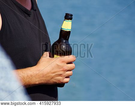 Having Cold Summer Beer Fun Time By The Baech With Clear Blue Water And Space For Graphics In The Ri