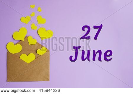 Brown Envelope With Yellow Hearts On Lilac Background And Inscription June 27, Holiday Concept.