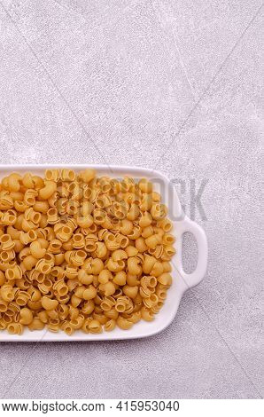 Traditional Dry Pasta On A Light Gray Background. Design Concept. A Copy Of The Space. Selective Foc