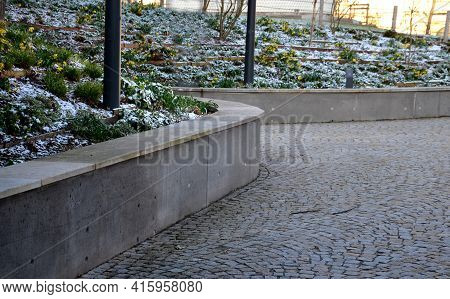 Retaining Wall At The Large Staircase In The Park Is A Flowerbed Area Planted With Rich Greenery Per