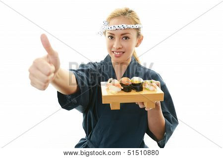 Smiling woman with sushi