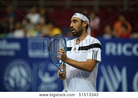 KUALA LUMPUR - SEPTEMBER 26: Marcos Baghdatis reacts after shot in a match against Stanilas Wawrinka at the Malaysia Open 2013 tennis played at the Putra Stadium, Malaysia on September 26, 2013.