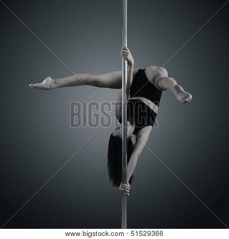 pole dancer, young woman dancing on pylon, toned and noise added