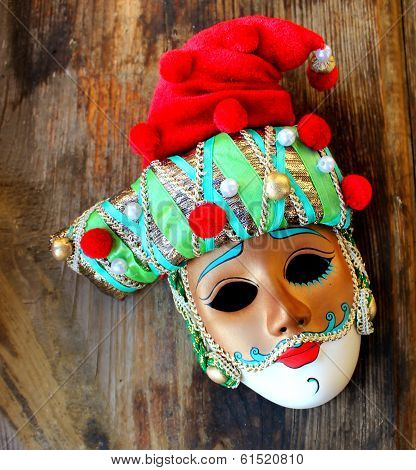Beautiful venetian masquerade mask in a red hat for the carnival in Venice