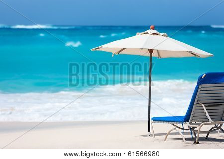 Chairs and umbrella on a beautiful tropical beach at Anguilla, Caribbean