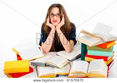 Young Girl Don't Want To Study, She Is Tired, Siting In Surrounding Of Colorful Books With Unhappy F