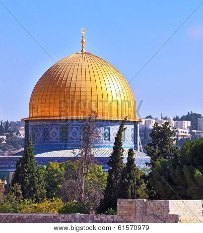 Golden Dome Mosque of Caliph Omar. The Holy City of Jerusalem is lit by the morning sun.