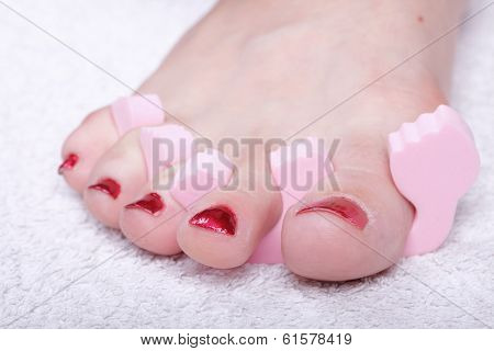 Female Feet Red Polished Nails