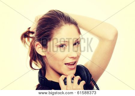 Young caucasian woman with headphones on her nack