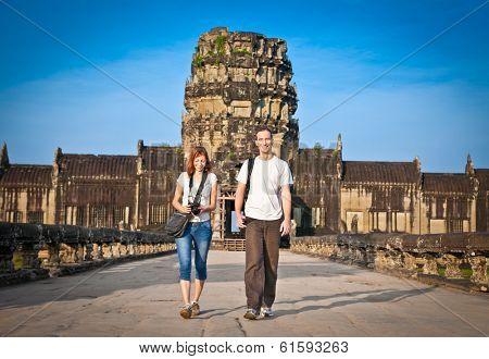 Beautiful young couple at  Angkor Wat temple complex, near Siem Reap, Cambodia.