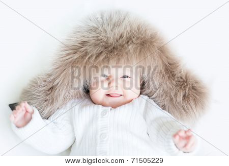 Laughing Baby In A Big Fur Hat