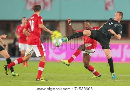 VIENNA, AUSTRIA - SEPTEMBER 10 David Alaba (#8 Austria) and James McCarthy (#8 Ireland) fight for the ball at a World Cup Qualifying game on September 10, 2013 in Vienna, Austria.