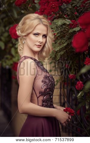 Portrait of beautiful young woman in garden