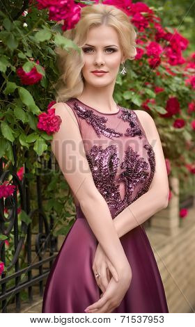 Portrait of beautiful young woman in garden