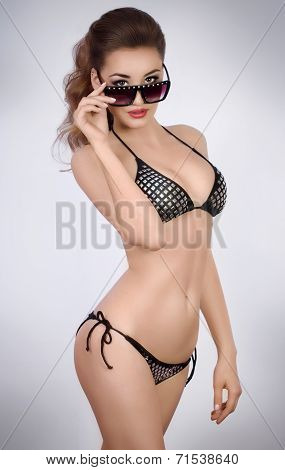 Woman in swimming suit on colorful background