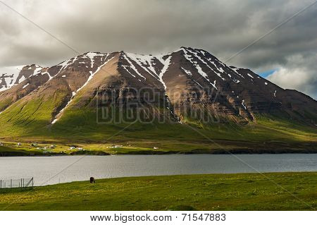 Mighty fjords with mountains covered by snow near Olafsfjordur, Northern Iceland