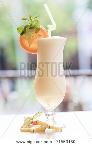 Milk cocktail with orange and carom
