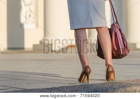 Legs of woman in the street