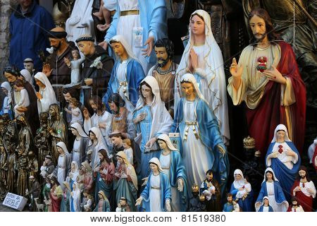 MARIJA BISTRICA, CROATIA - OCTOBER 26, 2013: Catholic Religious items, figurines of saints in one of the Souvenir shops in  pilgrimage Sanctuary Assumption of the Virgin Mary