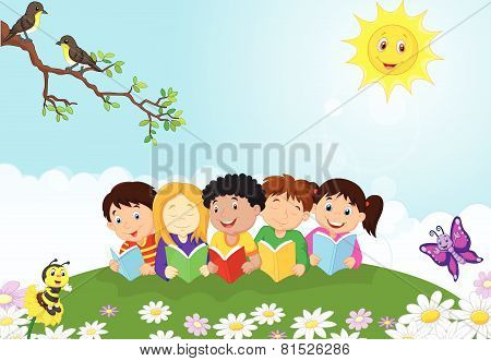 Happy children cartoon sitting on the grass while reading books