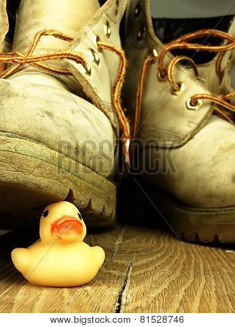 Rubber Duck Crushed By A Heavy, Old Military Boot.