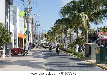 ISLA MUJERES - JANUARY 21: The main street  close to the beach and harbour on 21 January 2015 in Isla Mujeres, Mexico. The island is located 8 miles east of Cancun in the Gulf of Mexico.