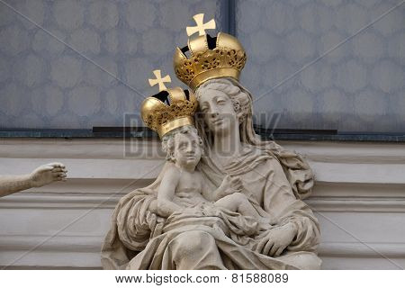 GRAZ, AUSTRIA - JANUARY 10, 2015: Virgin Mary with baby Jesus on the portal of Mariahilf church in Graz, Styria, Austria on January 10, 2015.