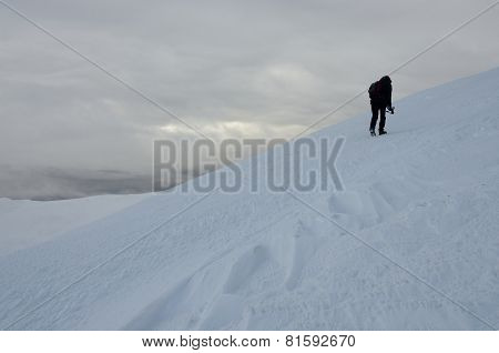 Lonely Photographer With Tripod Making Winter Trekking On Gimba Mountain During Great Snow Storm