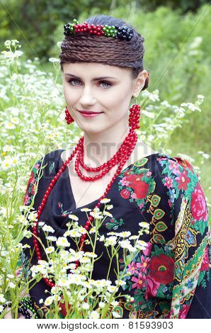 Happy Smiling Russian Woman Sitting In The Field