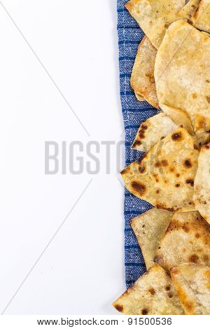 copy space with flat bread on checkered napkin