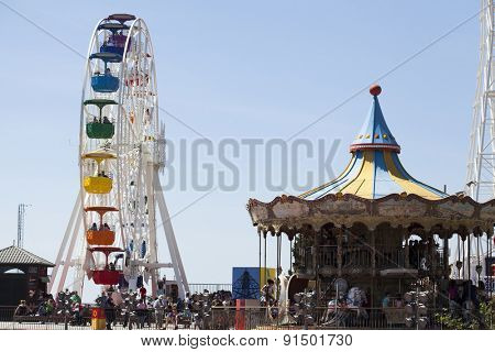 BARCELONA, SPAIN - MAY 2, 2015:  Ferrish-wheel and carousel in the Amusement Park on Mount Tibidabo in Barcelona, Catalonia, Spain