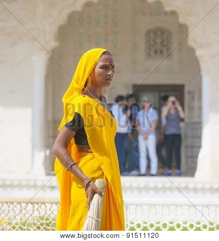 Woman Of Fourt Class In Brightly Colored Clothing Cleans The Amber Palace