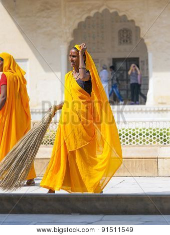 Woman Of Fourt Class In Brightly Colored Clothing Cleans The Amber Palace