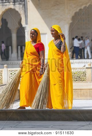 Woman Of Fourt Class In Brightly Colored Clothing Cleans The Amber Palace