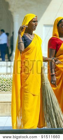Woman Of Fourt Class In Brightly Colored Clothing Cleans The Amber Palace
