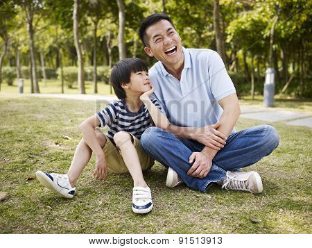 Asian Father And Son Having A Conversation