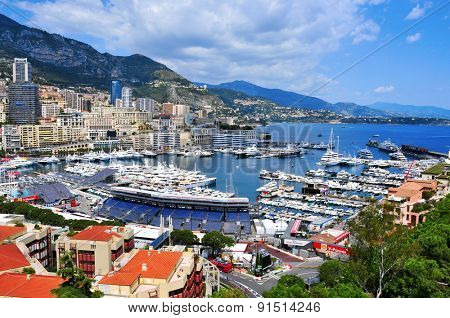 LA CONDAMINE, MONACO - MAY 16: Aerial view of the Port Hercules on May 16, 2015 in La Condamine, Monaco, during the preparations for the 73 Monaco Grand Prix, and Monte Carlo in the background