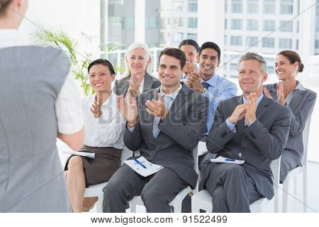 Business people listening during meting in office