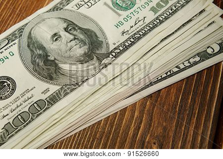 Bundle Of Money On Wooden Background