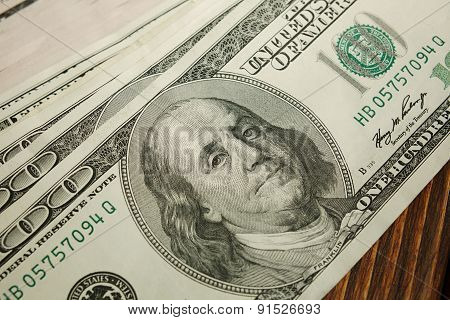 Bundle Of Money On Wooden Background