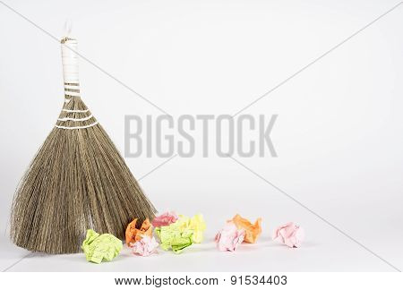 besom and color waste paper isolated