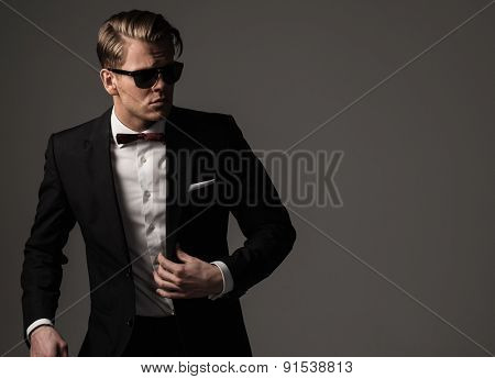 Tough sharp dressed man in black suit 