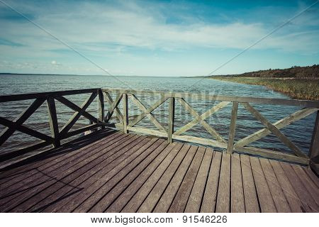 Wooden Pier On Big Lake Lebsko In Poland.