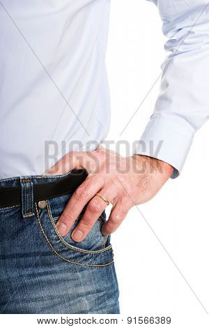 Close up man wearing jeans with hand on hip.