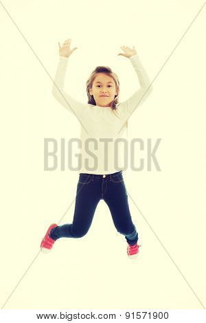 Little pretty girl jumping with joy
