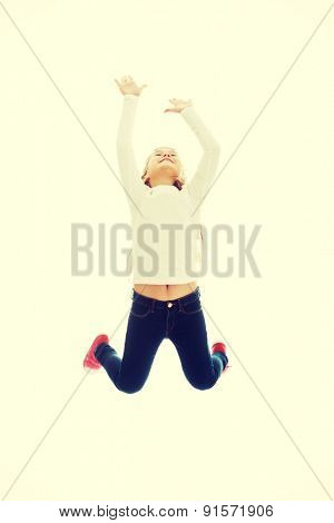 Little pretty girl jumping with joy