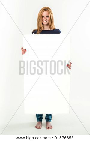 Young woman holding a blank banner
